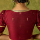 Exquisite maroon butti cotton silk blouse with rich festive appeal.