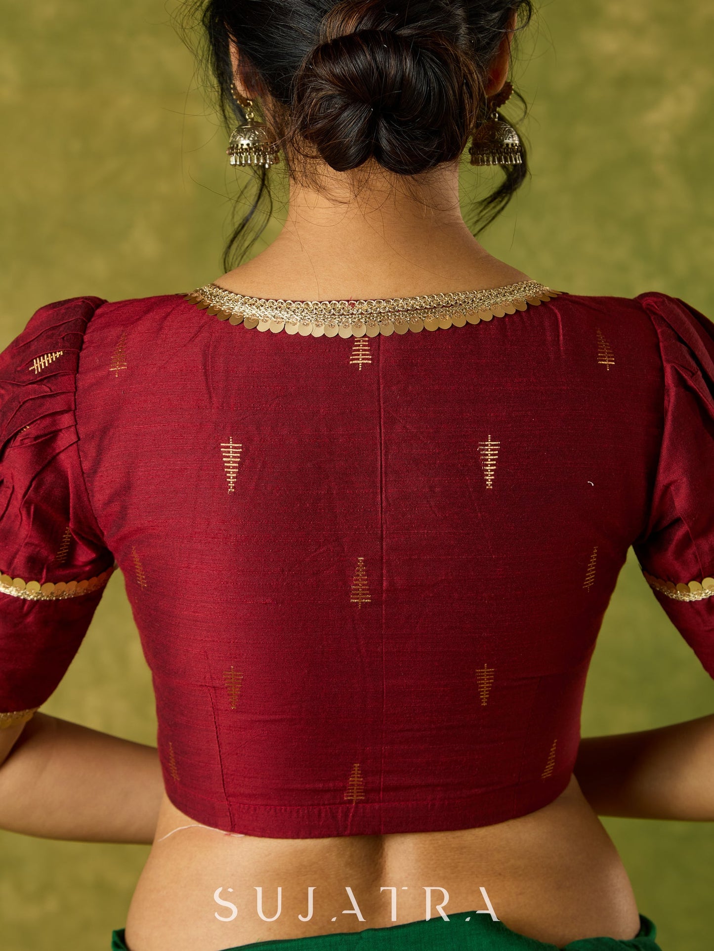 Exquisite maroon butti cotton silk blouse with rich festive appeal.