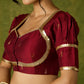 Exquisite maroon butti cotton silk blouse with rich festive appeal.