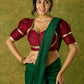 Exquisite maroon butti cotton silk blouse with rich festive appeal.