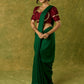 Exquisite maroon butti cotton silk blouse with rich festive appeal.