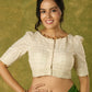 Elegant off-white chanderi blouse beautifully highlighted with delicate lace