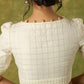 Elegant off-white chanderi blouse beautifully highlighted with delicate lace