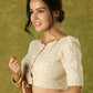Elegant off-white chanderi blouse beautifully highlighted with delicate lace