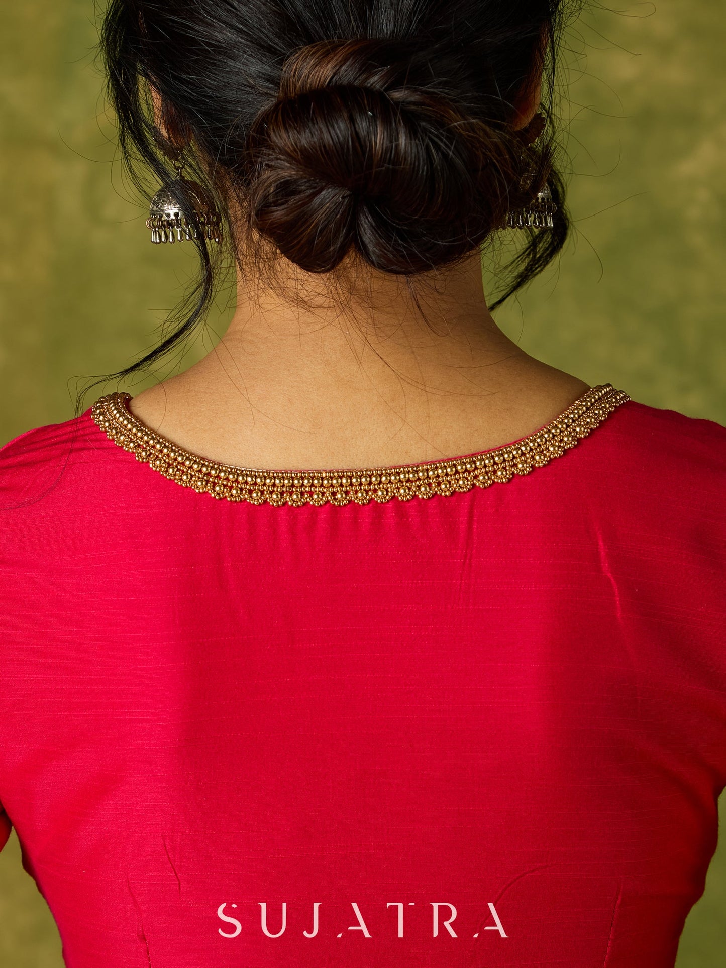 Elegant hand embroidered dark pink cotton silk blouse with intricate detailing.