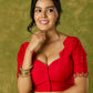 Festive hand embroidered red cotton silk blouse with elegant scallop detailing.