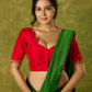 Festive hand embroidered red cotton silk blouse with elegant scallop detailing.