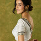 Elegant white Chanderi blouse with V-neck and lace highlights