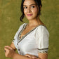 Elegant white Chanderi blouse with V-neck and lace highlights