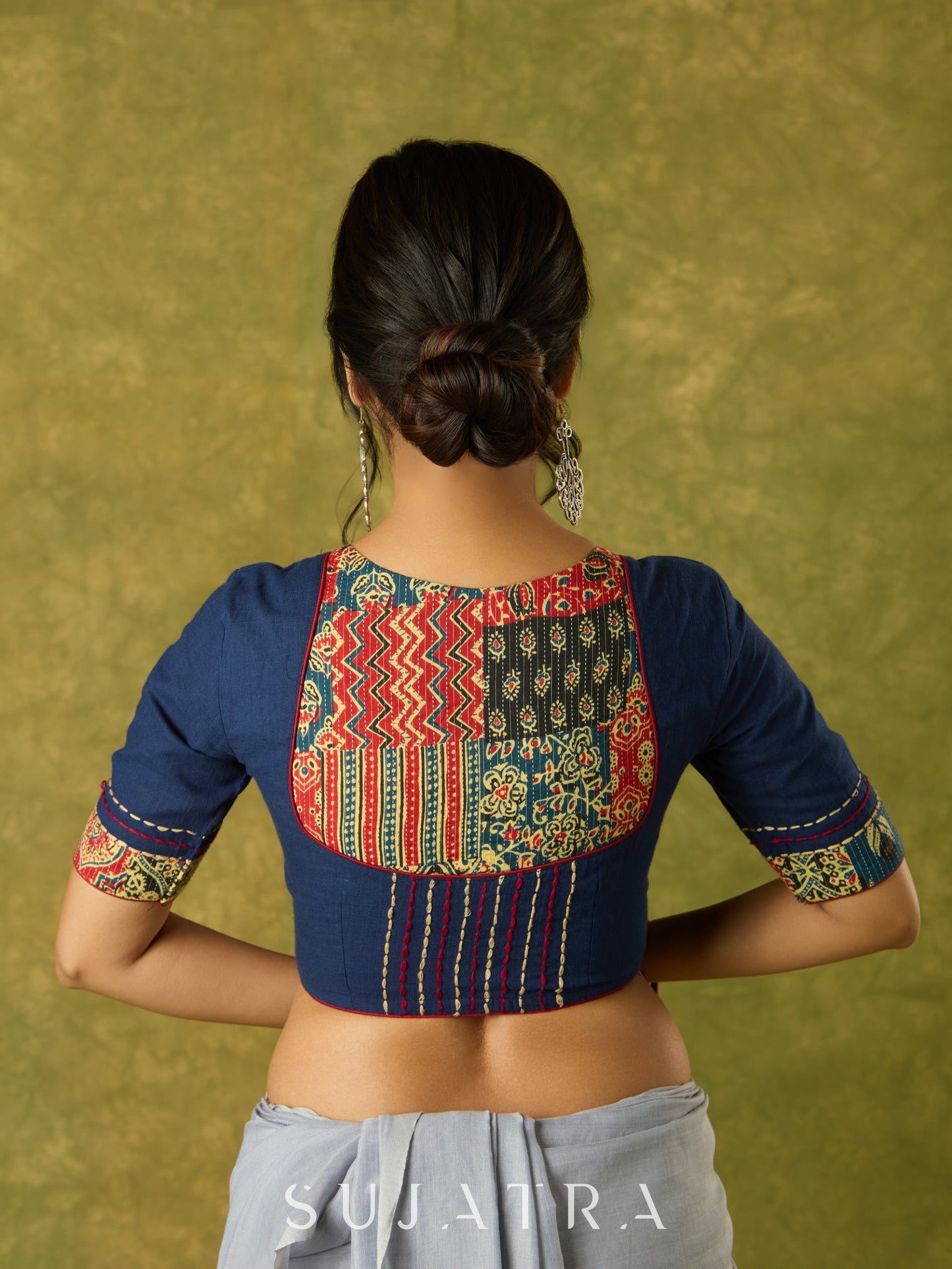 Beautifully hand embroidered navy blue blouse with stylish fabric combination.