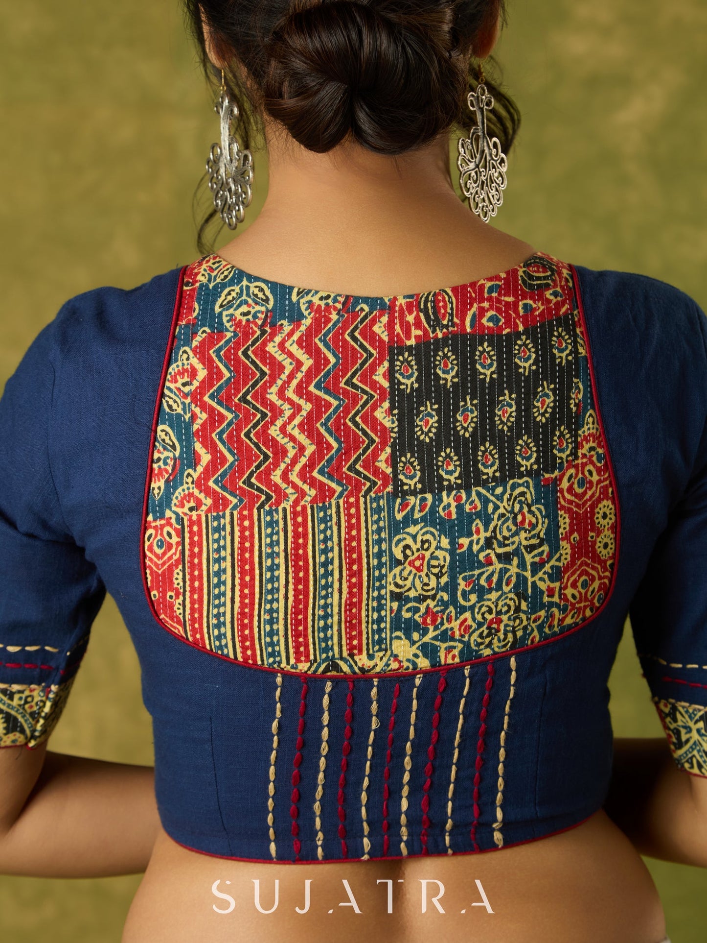 Beautifully hand embroidered navy blue blouse with stylish fabric combination.