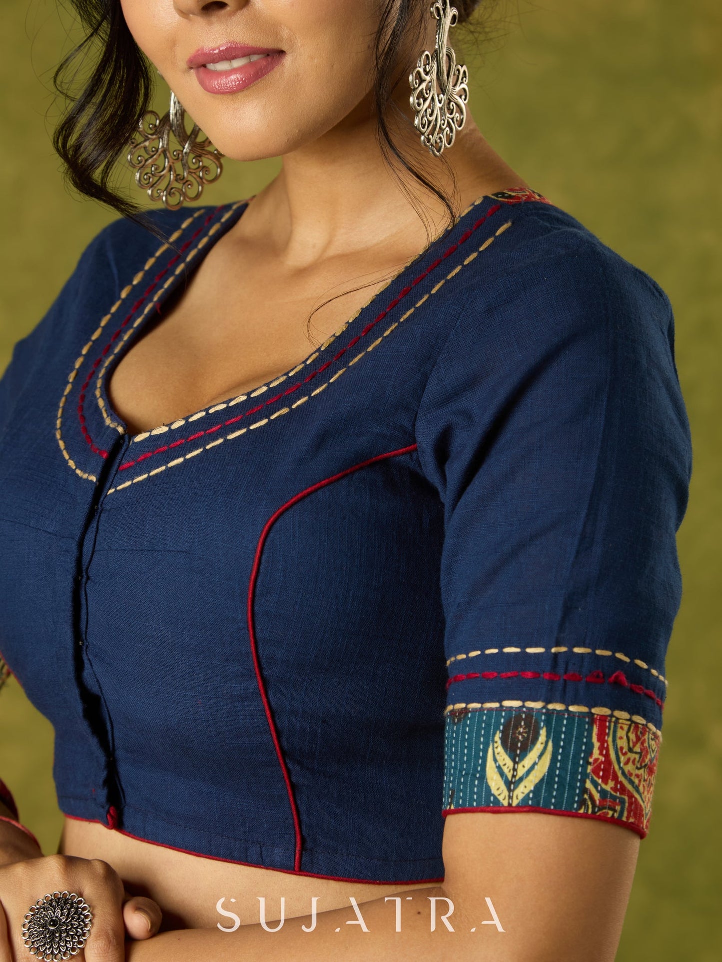 Beautifully hand embroidered navy blue blouse with stylish fabric combination.