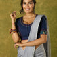 Beautifully hand embroidered navy blue blouse with stylish fabric combination.