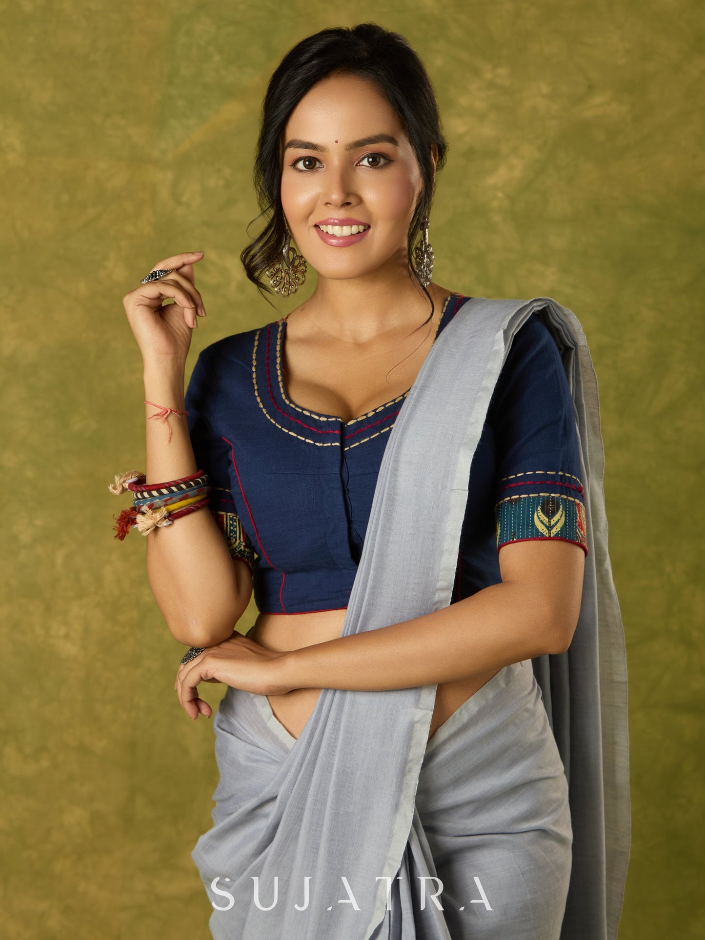 Beautifully hand embroidered navy blue blouse with stylish fabric combination.