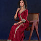 Heritage Maroon Bandhani A-Line Angarkha Gown with Minimal Lace Embellishment & Statement Tassels