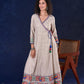 Artisanal Beige Handloom Cotton Angarkha Long Gown with Madhubani Border Embellished Neckline, Sleeve & Flare, with Vibrant Statement Tassels
