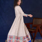Artisanal Beige Handloom Cotton Angarkha Long Gown with Madhubani Border Embellished Neckline, Sleeve & Flare, with Vibrant Statement Tassels