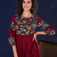Timeless Maroon Rayon Layered Gown with Gathers and Hand Painted Kalamkari Accents featuring Puffy Sleeves and Delicate Golden Accents