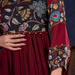 Timeless Maroon Rayon Layered Gown with Gathers and Hand Painted Kalamkari Accents featuring Puffy Sleeves and Delicate Golden Accents