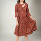 Rust Ajrakh printed dress with asymmetrical neckline & contrast detailing