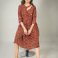 Rust Ajrakh printed dress with asymmetrical neckline & contrast detailing