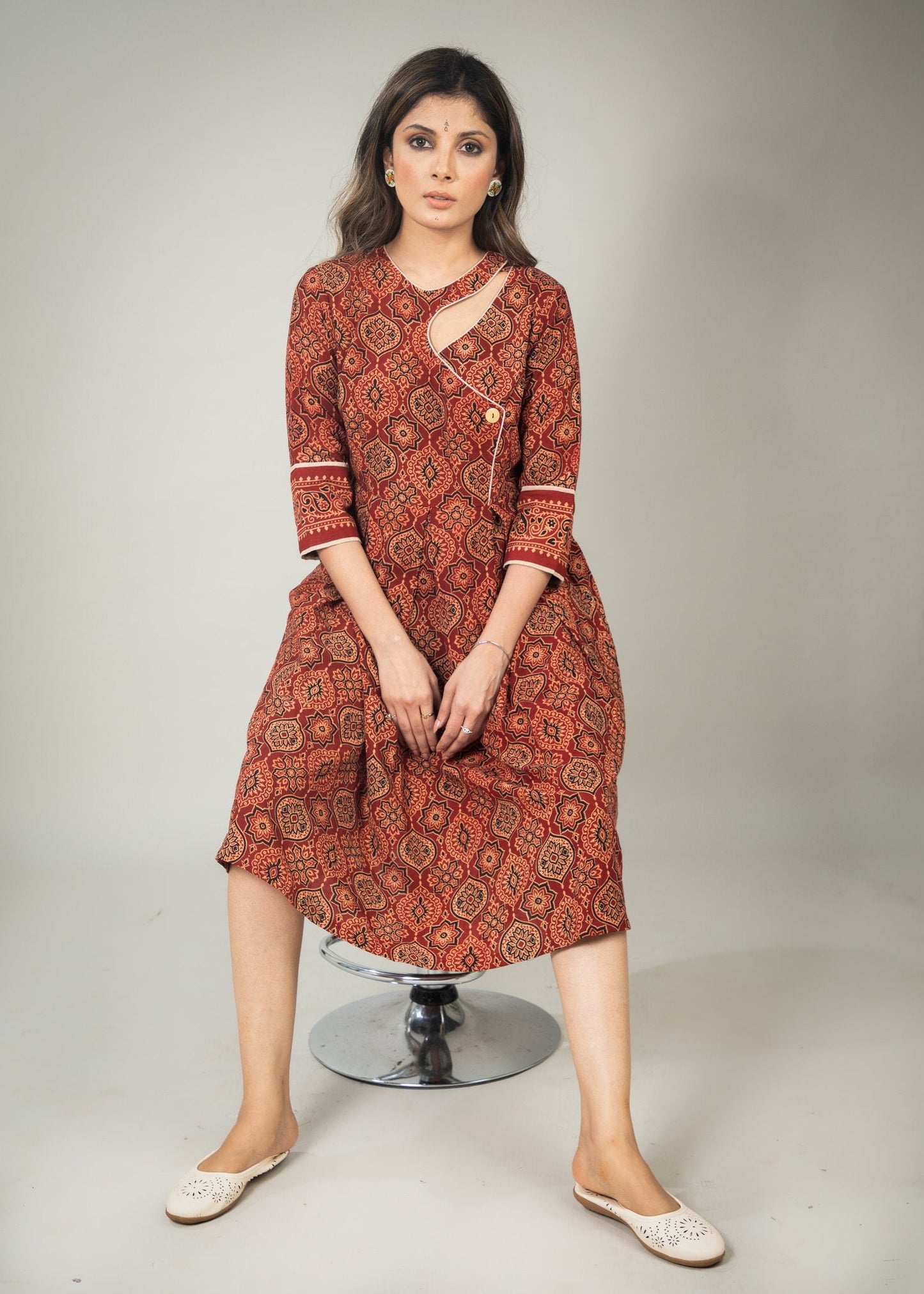 Rust Ajrakh printed dress with asymmetrical neckline & contrast detailing