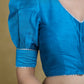 Striking Firozi Blue Puff Sleeves Elbow Length Blouse with Silver Detailing