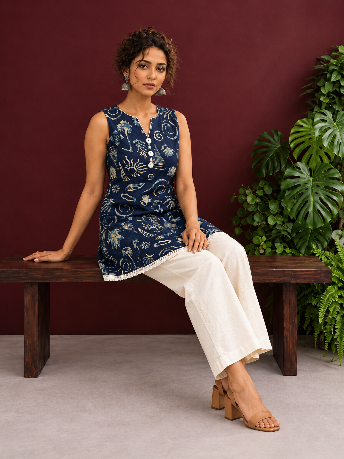 Navy Blue Batik Print Cotton Tunic with Ivory Lace Hemline & Mother-of-Pearl Button Placket — seated
