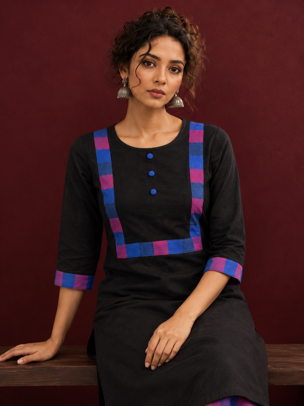 Timeless Black Cotton Kurta with Contrast Checkered Yoke Panel — seated detail