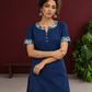Navy Blue Cotton Kurta with Floral Printed Neckline and Sleeve Cuffs — styled view