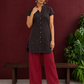 Timeless Black Cotton Tunic with Maroon Polka Dot Print and Gold Triangle Button Placket — front view