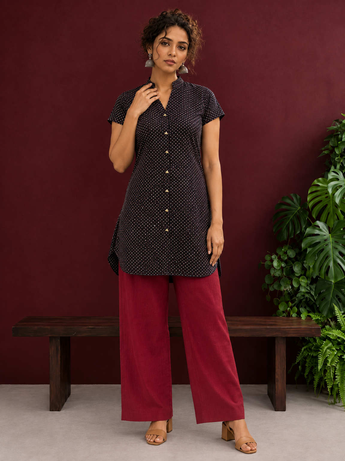Timeless Black Cotton Tunic with Maroon Polka Dot Print and Gold Triangle Button Placket — front view