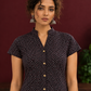 Timeless Black Cotton Tunic with Maroon Polka Dot Print and Gold Triangle Button Placket — fabric detail