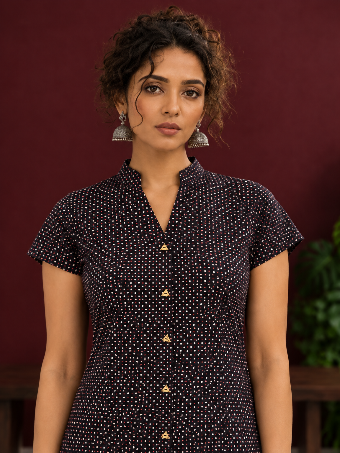 Timeless Black Cotton Tunic with Maroon Polka Dot Print and Gold Triangle Button Placket — fabric detail