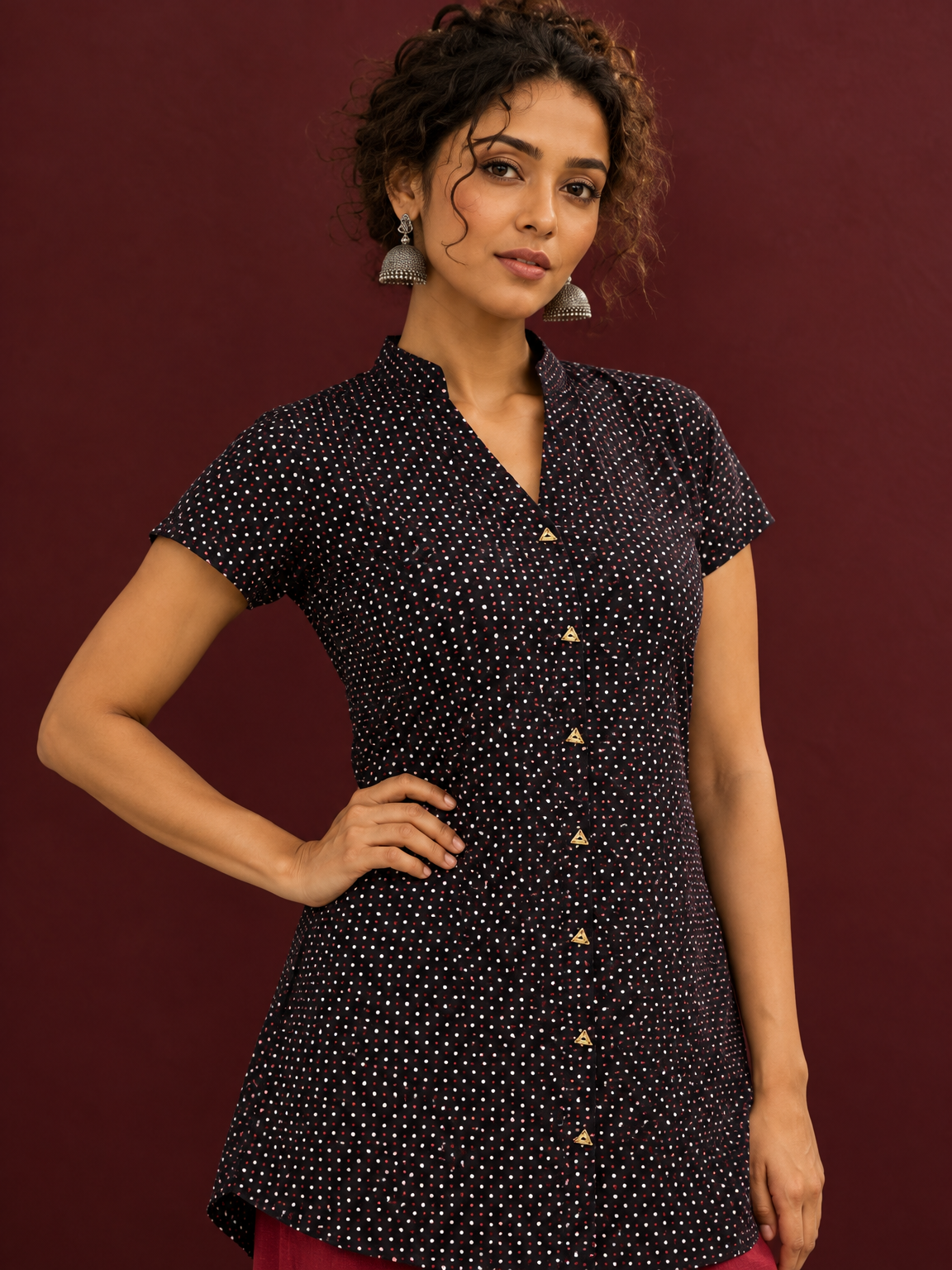 Timeless Black Cotton Tunic with Maroon Polka Dot Print and Gold Triangle Button Placket — styled view