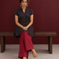 Timeless Black Cotton Tunic with Maroon Polka Dot Print and Gold Triangle Button Placket — seated