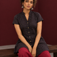 Timeless Black Cotton Tunic with Maroon Polka Dot Print and Gold Triangle Button Placket — seated detail