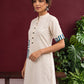 Classic Off-White Cotton Kurta with Contrast Geometric Print Pocket & Coordinated Sleeve Cuffs — styled view
