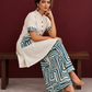 Classic Off-White Cotton Kurta with Contrast Geometric Print Pocket & Coordinated Sleeve Cuffs — seated
