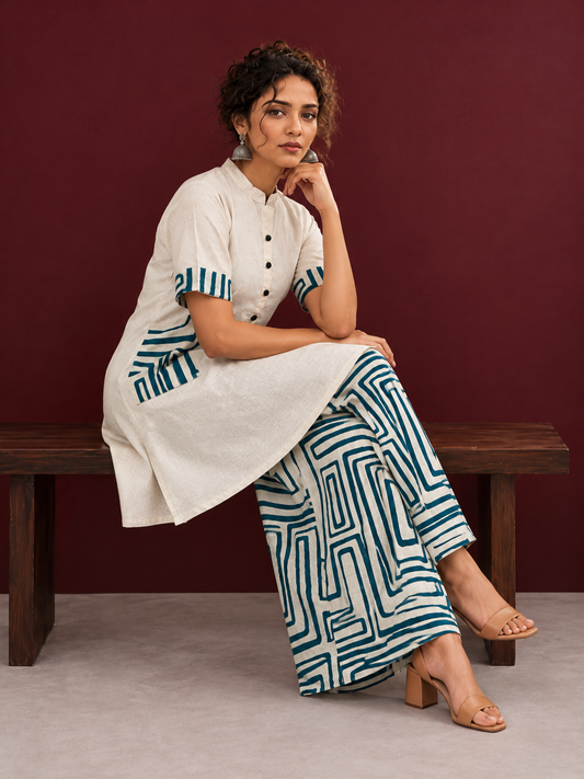 Classic Off-White Cotton Kurta with Contrast Geometric Print Pocket & Coordinated Sleeve Cuffs — seated