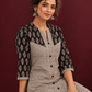 Elegant Black & Beige Cotton Tunic with Chevron Print Body and Floral Block Print Yoke & Sleeves — seated detail