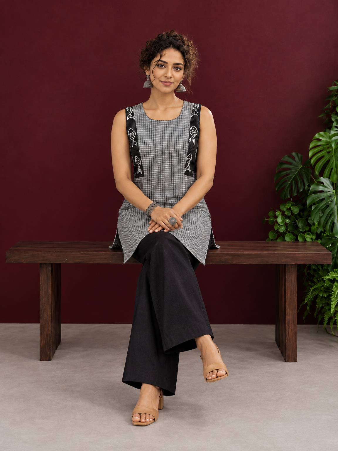 Grey Checked Cotton Kurta with Black Embroidered Fish Motif Shoulder Straps & Side Slits — seated