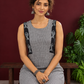 Grey Checked Cotton Kurta with Black Embroidered Fish Motif Shoulder Straps & Side Slits — seated detail