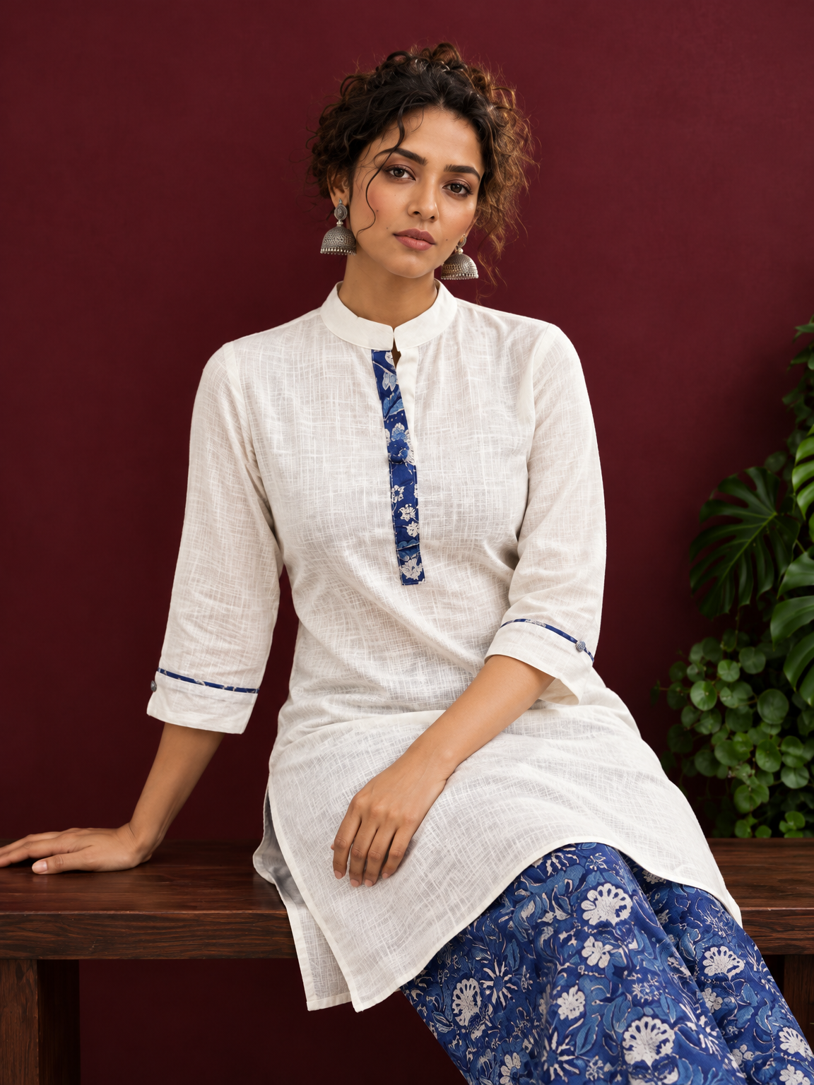 Timeless Off-White Cotton Kurta with Contrast Indigo Floral Print Placket — seated detail