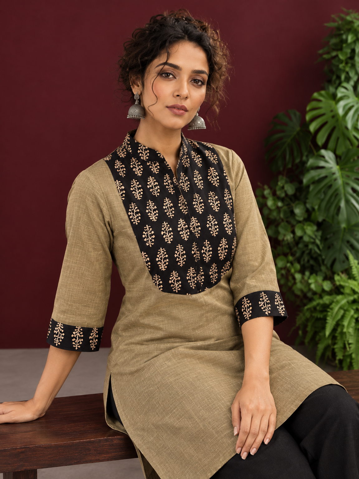 Classic Beige Cotton Kurta with Contrast Black Floral Print Yoke & Coordinated Sleeve Cuffs — seated detail