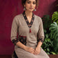 Elegant Beige Cotton Ajrakh Tunic with Contrast V-Neck & Cuff Detailing — seated detail