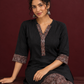 Timeless Black Cotton Tunic with Contrast Ajrakh Print V-Neck Placket & Coordinated Sleeve Cuffs — seated detail