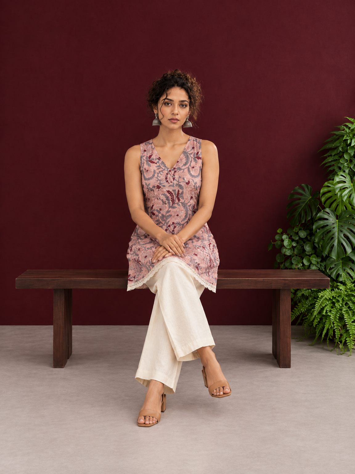 Elegant Pink Cotton Tunic with Grey & Maroon Floral Print and Lace Trim Hemline — seated