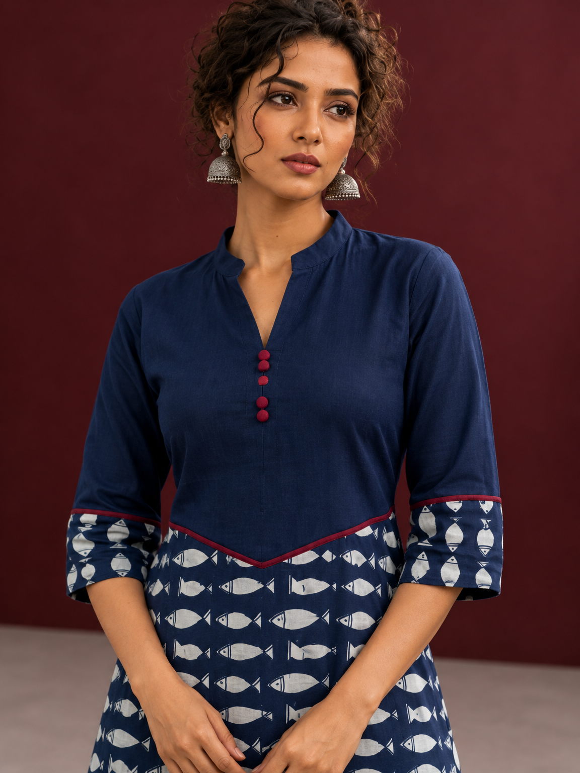 Navy Blue Cotton Tunic with Fish Print Hem Panel, Contrast Maroon Piping & Red Button Detail — fabric detail