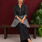 Classic Black & White Pinstripe Tunic with Contrast Striped Panel and Mandarin Collar — seated detail